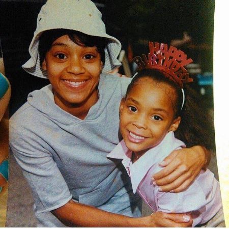 A picture of Lisa "Left Eye" Lopes and Snow Lopes. 